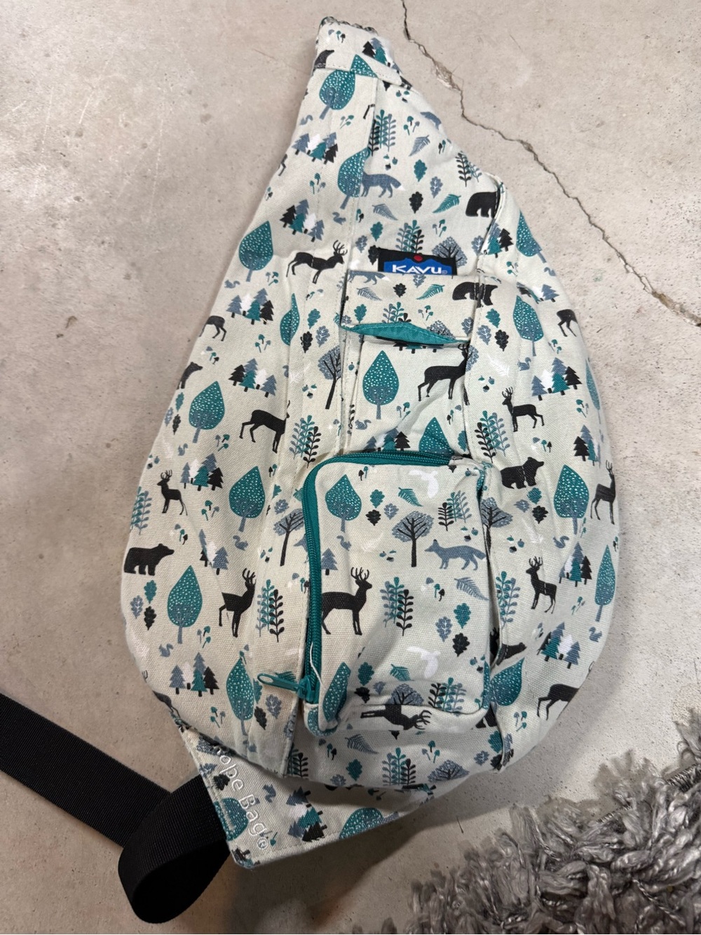 Kavu Teal and Cream Forest Animal Sling Bag